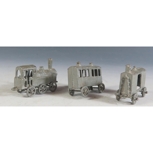 131A - A Small Unusual Early 20th Century Penny Toy 3 Piece Train (12.cm approx overall length).