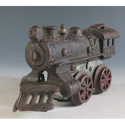 132 - An Early American Flyer Cast Iron Locomotive Clockwork Train in working condition (17cm approx).