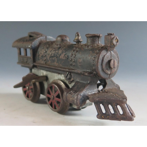 132 - An Early American Flyer Cast Iron Locomotive Clockwork Train in working condition (17cm approx).