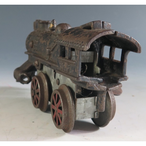 132 - An Early American Flyer Cast Iron Locomotive Clockwork Train in working condition (17cm approx).