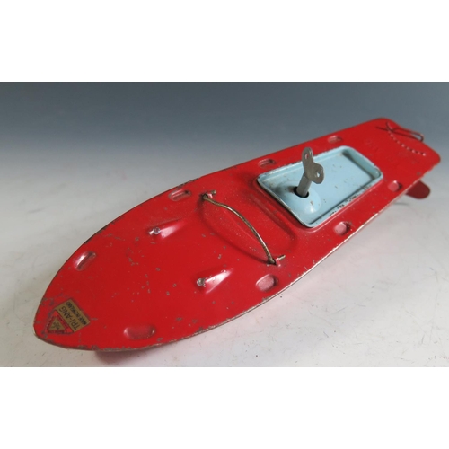 134 - A Triang Clockwork Tinplate Boat in Red and Blue, working motor(26cm approx).