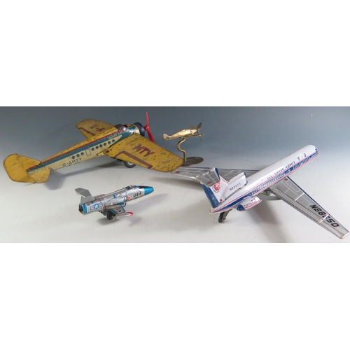 149 - Four Tinplate Airplanes and One Brass including A Japanese Daiya Tinplate Friction Drive Airliner 