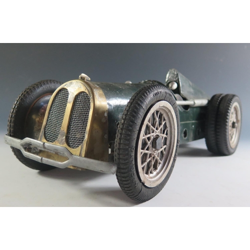 156 - An Unusual Three Spring Driven Race Car. The front tyres are marked Meccano however I do not think t... 