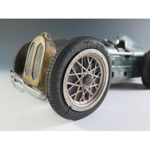 156 - An Unusual Three Spring Driven Race Car. The front tyres are marked Meccano however I do not think t... 