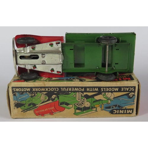 17 - A Triang Minic Clockwork Delivery Lorry in red and green with black hubs. It is in near mint working... 