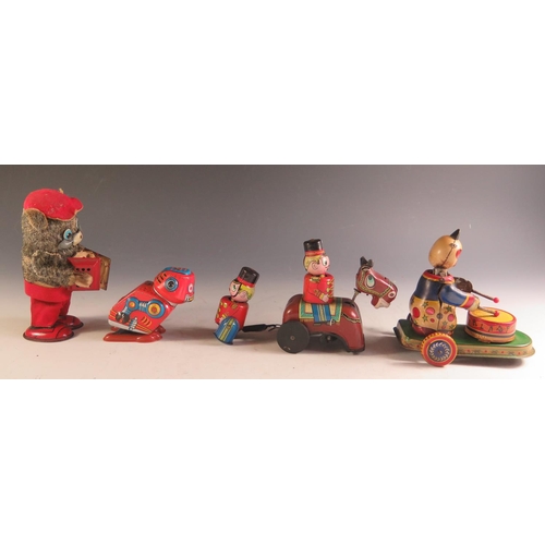 170 - Four Clockwork Tinplate Toys Including a Drumming Pander, Accordion playing bear, Robot and Guardsma... 