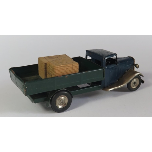 18 - A Triang Minic Clockwork Delivery Lorry in dark blue, dark green and chrome. Motor works.