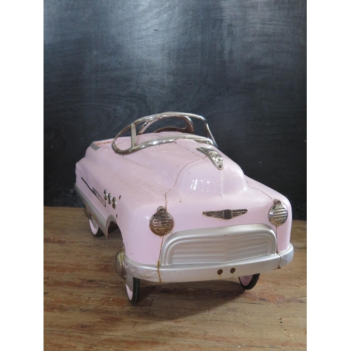 196 - A 1950's Style Metal Super Sports Pedal Car in Pink (100cm approx).