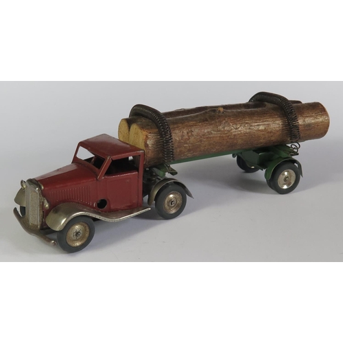 30 - A Triang Minic Clockwork 74M Mechanical Horse and Log Trailer in red/brown and green. Working motor.