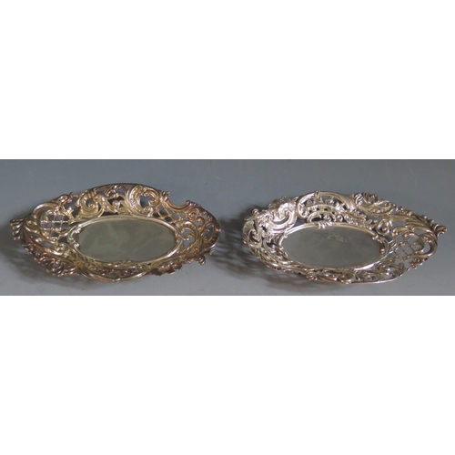 352 - A Pair of Victorian Pierced Silver Bonbon Dishes with embossed foliate scroll decoration , Birmingha... 