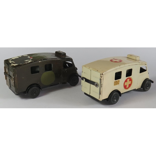 38 - A Triang Minic Clockwork 75M Ambulance and one other repainted both with working motors.