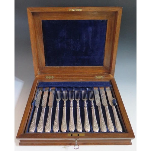 395 - A Victorian Walnut Canteen of Twelve Knives and Forks, Sheffield 1863, Martin, Hall & Co.