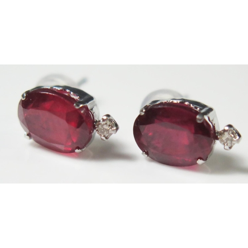 403 - A Pair of 18K White Gold, Ruby and Diamond Earrings, 1.6g, ruby 8x6mm