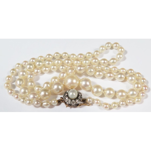 404 - A Graduated Pearl Single Strand Necklace with old cut diamond and pearl unmarked gold clasp, 14.8g, ... 