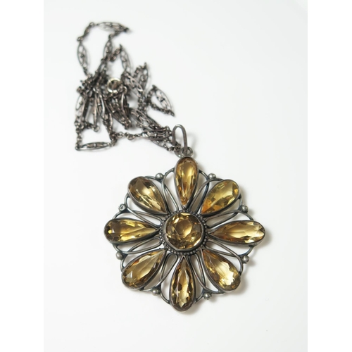 408 - A Silver Set Citrine Flower Head Pendant on chain, pendant 44mm diam., necklace 48cm long, 14.9g