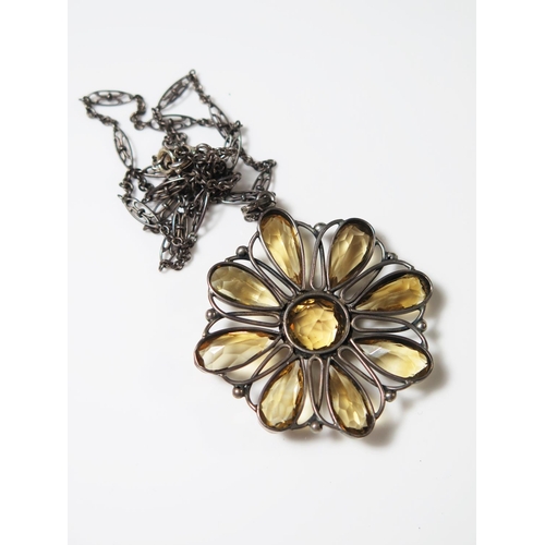 408 - A Silver Set Citrine Flower Head Pendant on chain, pendant 44mm diam., necklace 48cm long, 14.9g