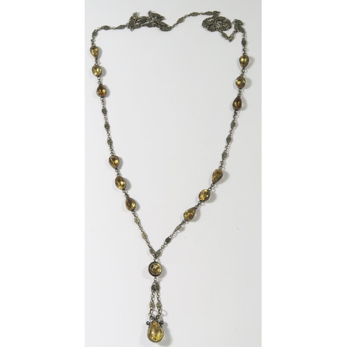 409 - A 19th Century Citrine and unmarked silver necklace, largest stone 19x 13mm, drop c. 7cm, chain. c. ... 