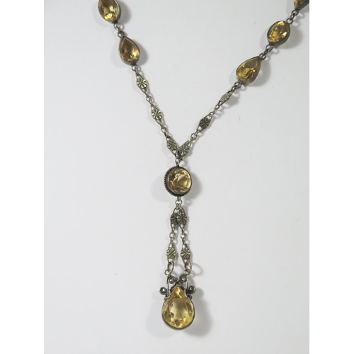 409 - A 19th Century Citrine and unmarked silver necklace, largest stone 19x 13mm, drop c. 7cm, chain. c. ... 