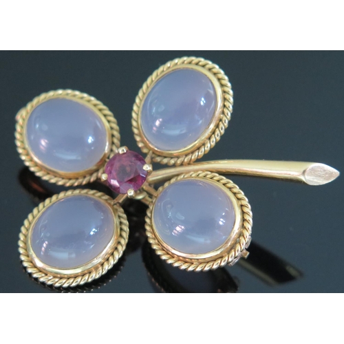 419 - A French 18ct Gold, Moonstone and Ruby Flower Head Brooch, 20.3g, 50mm high, ruby 7mm diam., eagle h... 