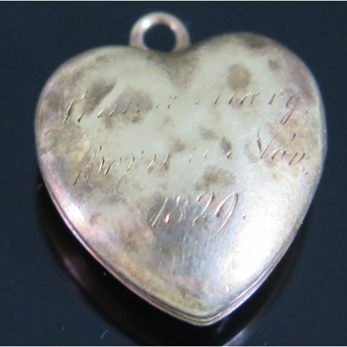 430 - A George IV Unmarked Gold Heart Locket with hinged crystal interior, inscribed and dated 1829, 20mm ... 