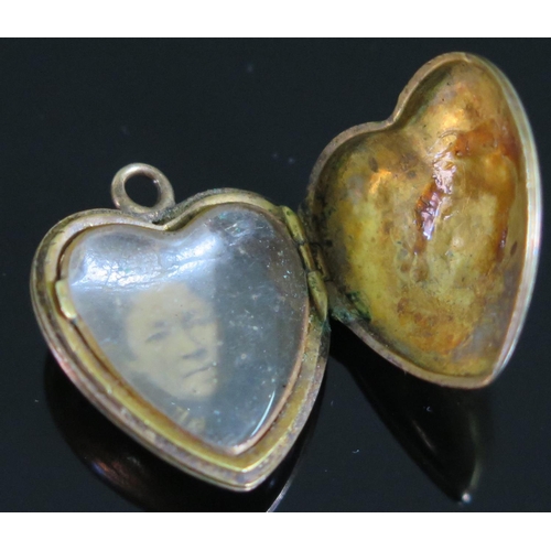 430 - A George IV Unmarked Gold Heart Locket with hinged crystal interior, inscribed and dated 1829, 20mm ... 