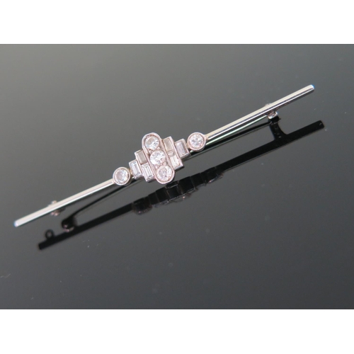 436 - An Art Deco Diamond Bar Brooch in an 18ct White Gold and Platinum Setting with round and baguette cu... 