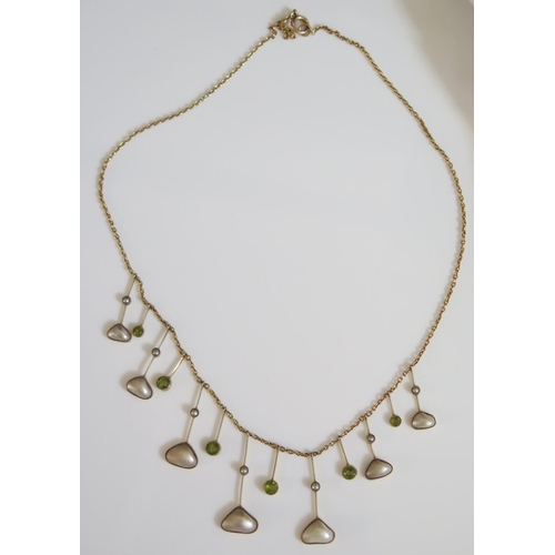 442 - A Peridot and Blister Pearl Necklace in an unmarked gold setting, 9.4g, 43cm long, longest drop 32mm