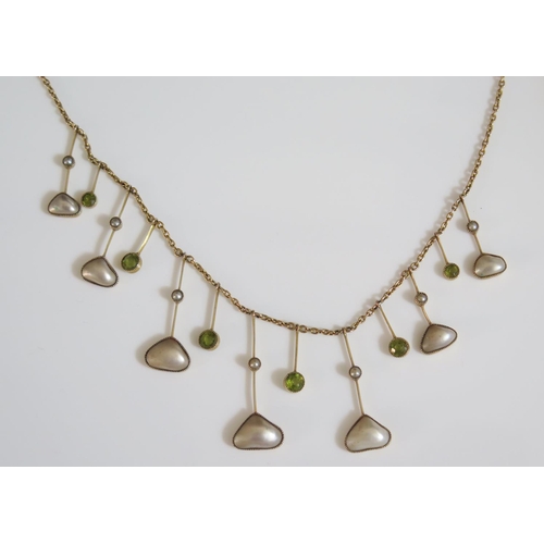 442 - A Peridot and Blister Pearl Necklace in an unmarked gold setting, 9.4g, 43cm long, longest drop 32mm