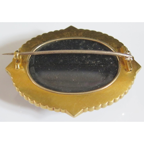 442A - A Large Victorian Banded Onyx and Pearl Brooch in an unmarked high carat gold setting with black ena... 