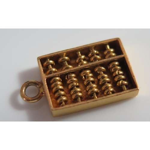 449 - An Unmarked Gold Charm in the form of an abacus, 1.2g, 14mm