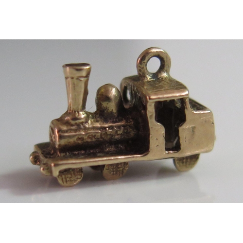 451 - A 9ct Gold Charm in the form of a steam train, 2.6g, 16mm long