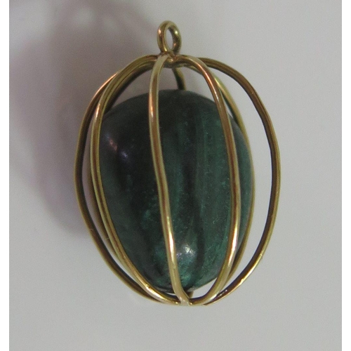 453 - An Unmarked Gold Charm in the form of a basket containing a malachite sample, 4.4g, 20mm