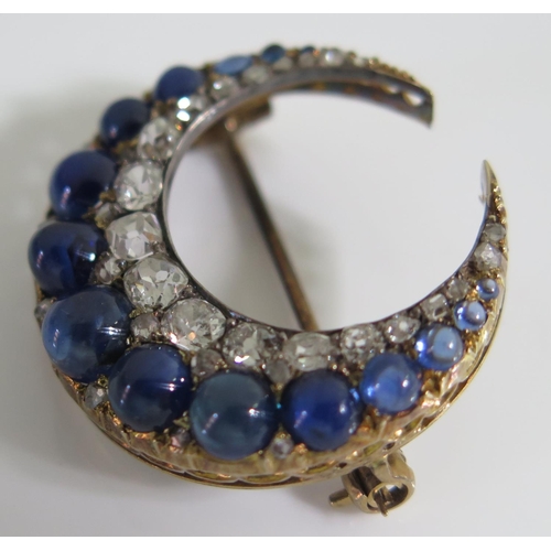 454 - A Victorian Cabochon Sapphire and Old Cut Diamond Crescent Brooch, 5.2g, 27mm diam., probably Ceylon... 