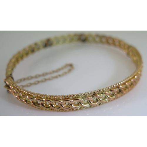 455 - An Unmarked Gold Hinged Bangle with patent clasp, 9.4g, 57mm wide