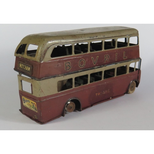 47 - An Early Triang Minic Clockwork 60M Double Deck Bus in maroon and grey (not working, missing motor p... 