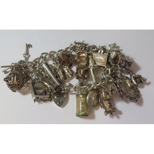 478 - A Heavy Silver Charm Bracelet, 85.7g