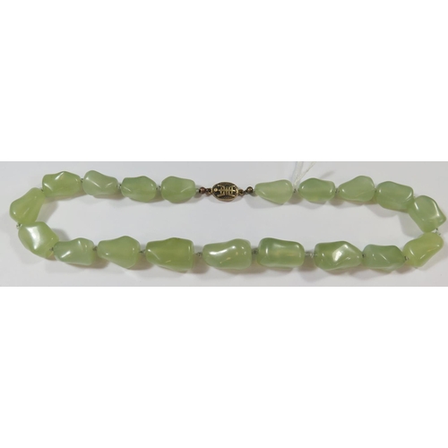 487 - A Chinese Jadeite Necklace with silver gilt clasp, 48cm long, 115g