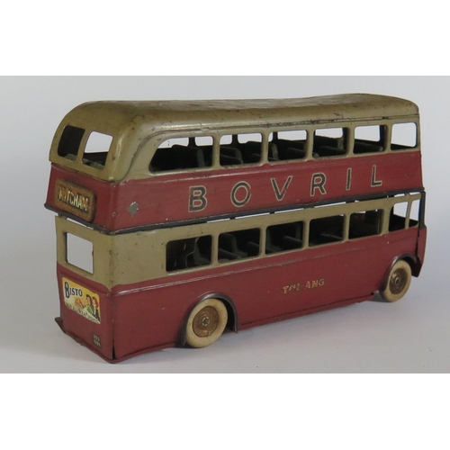 49 - An Early Triang Minic Clockwork 60M Double Deck Bus in maroon and grey with working motor.