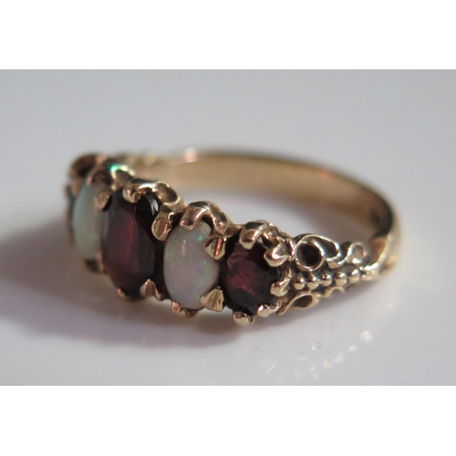 506 - A 9ct Gold, Opal and Garnet Five Stone Ring, size N, 3.8g