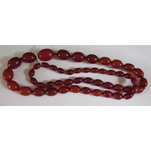 512 - A Faux Orange Red Amber Bead Necklace, 93cm, largest bead 29x21mm, 106g