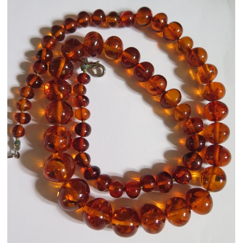 517 - A Graduated Orange Amber Bead Necklace with inclusions, 52cm, 30g