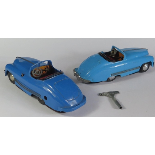 54 - Two Triang Minic Geared No. 2 Sports Cars in light blue and dark blue. One motor needs attention. On... 