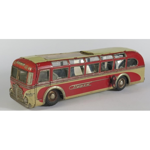 67 - A Tinplate Clockwork Tippco Coach in Red and grey/cream made in Germany (24cm approx). Motor works.