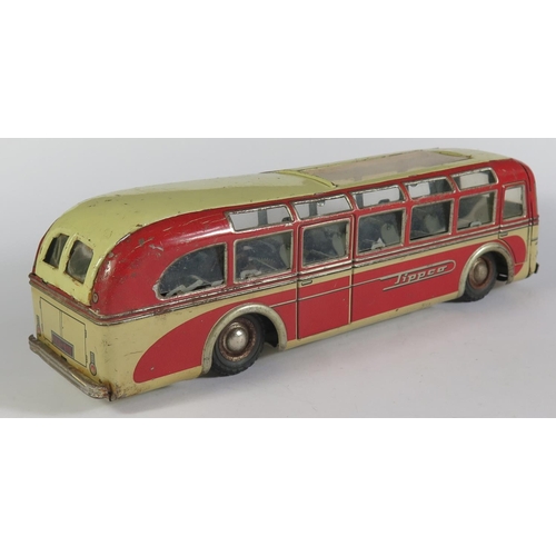 67 - A Tinplate Clockwork Tippco Coach in Red and grey/cream made in Germany (24cm approx). Motor works.