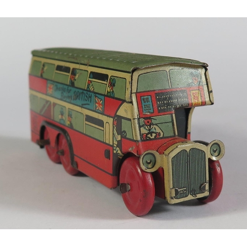 69 - A Wells Brimtoy Tinplate 6 Wheeled Double Deck Bus. Working but no key. (10.5cm approx).