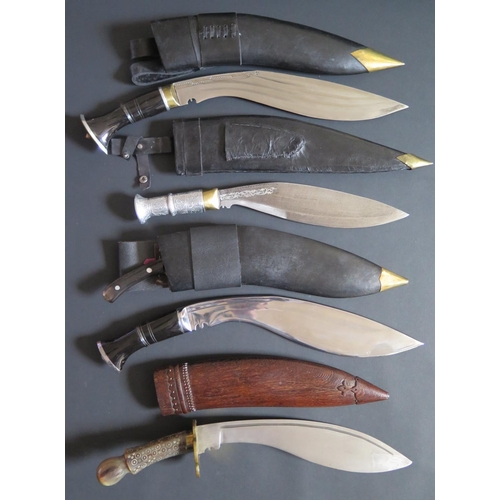 706 - An Ornamental Kukri, 50cm overall length and three others