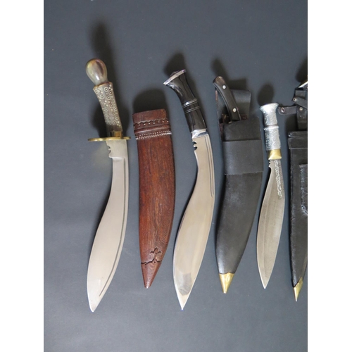 706 - An Ornamental Kukri, 50cm overall length and three others