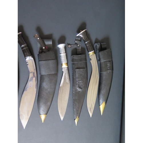 706 - An Ornamental Kukri, 50cm overall length and three others