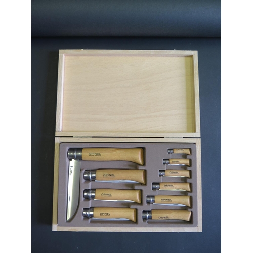 727 - An OPINEL 10-PIECE CARBON STEEL FOLDING KNIFE SET IN A WOODEN CASE