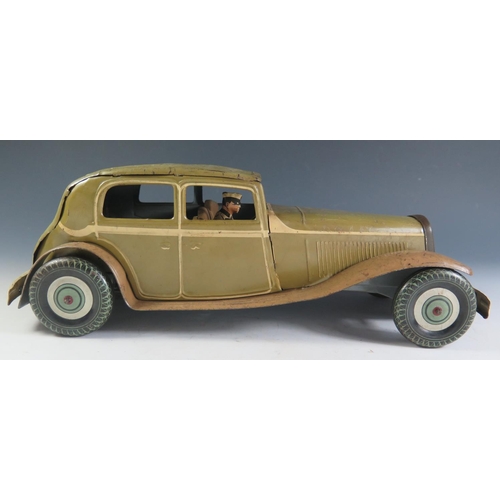 79 - A Large Scale Mettoy Clockwork Tinplate Car in Olive Green with cream detailing and light brown side... 